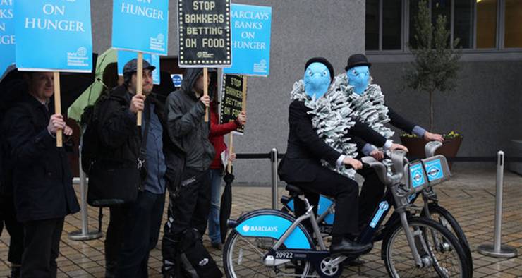 Description: Demonstrators, including several dressed as Barclays' eagle emblem, gathered outside the bank's shareholder meeting in London on Friday.